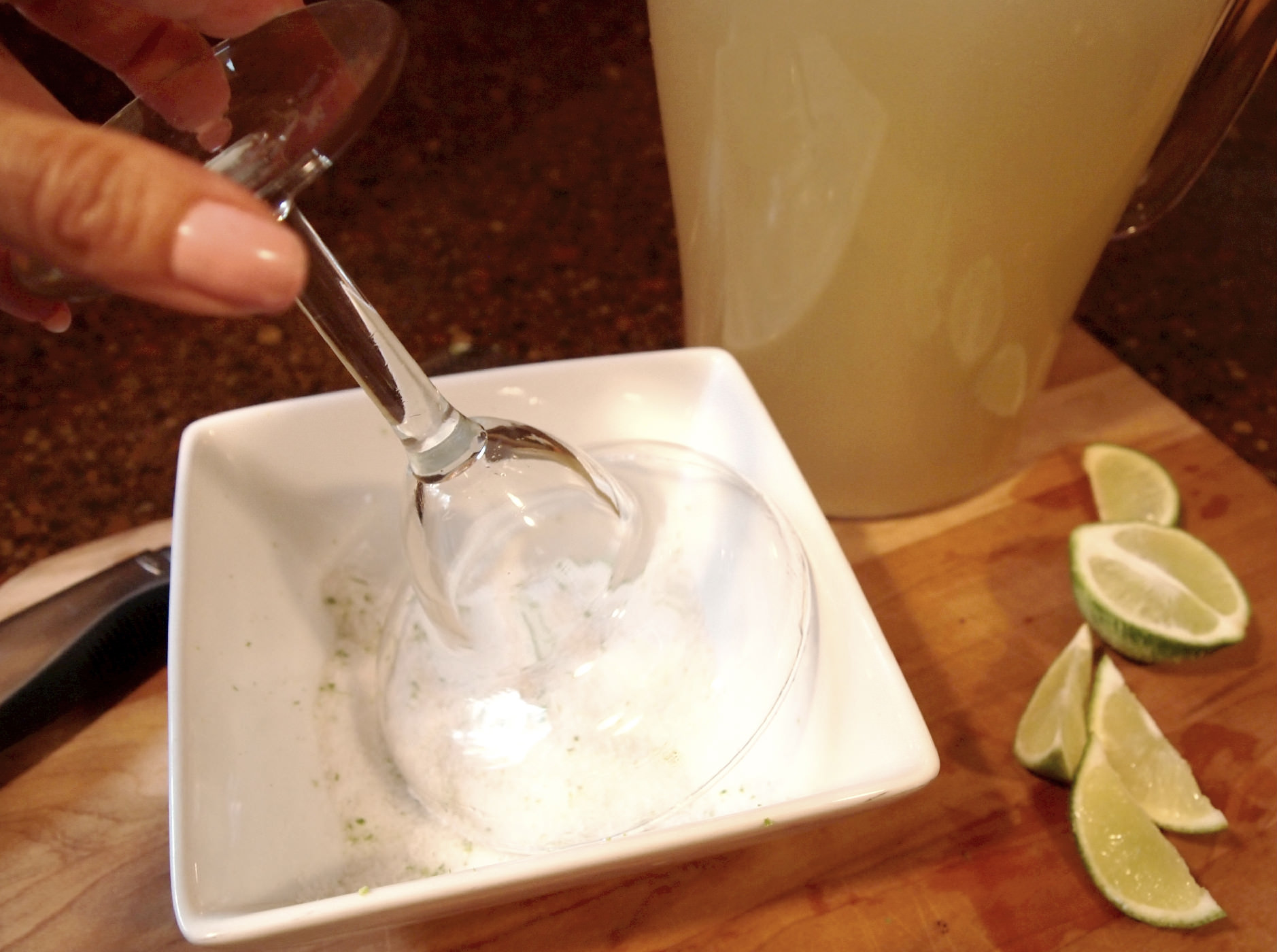 Salting the rim of a glass for a margartia