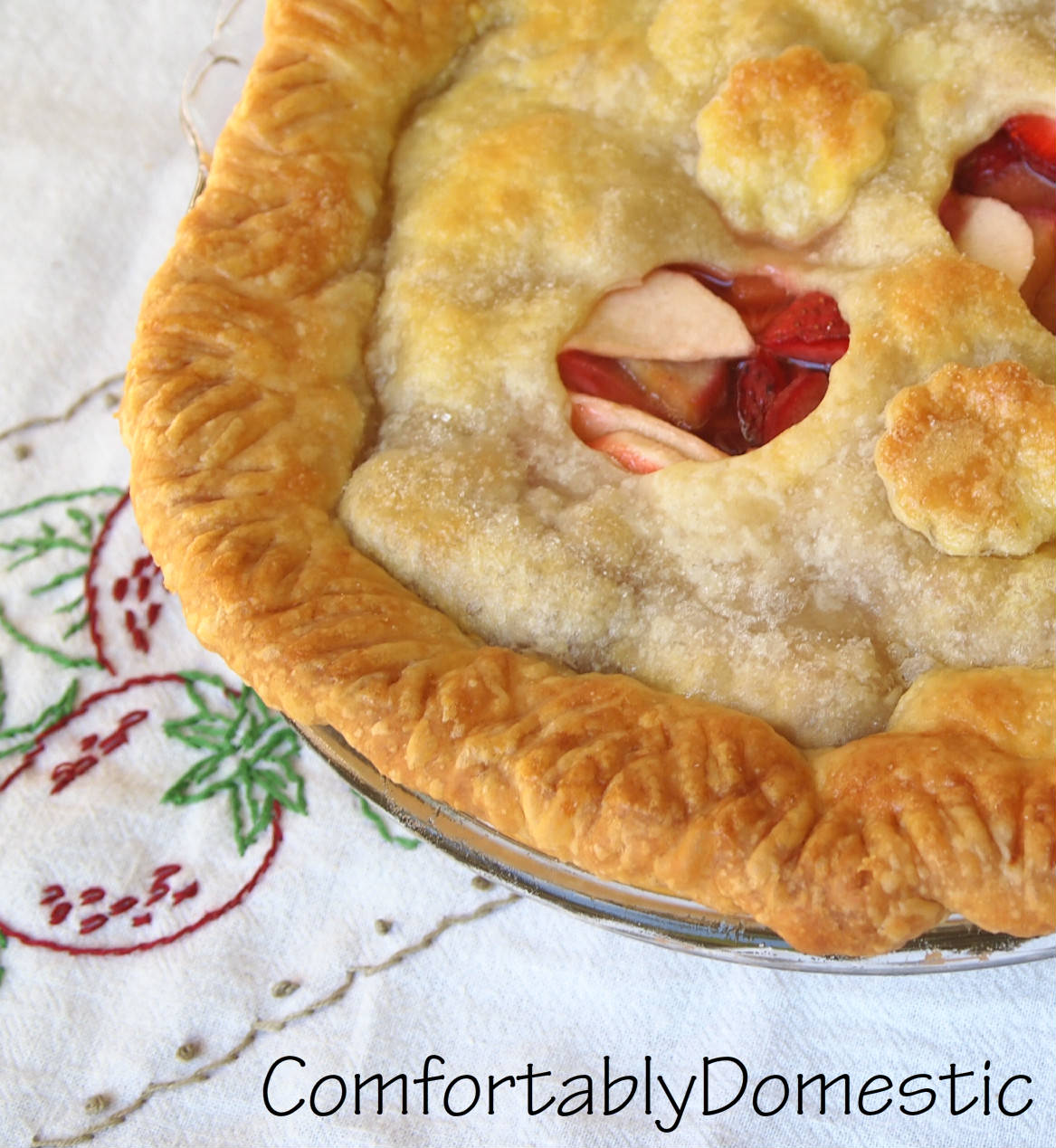 Strawberry rhubarb apple pie bakes fresh strawberries, rhubarb, and apples into a tender, buttery crust. The perfect trio of flavors for a spectacular dessert! | ComfortablyDomestic.com